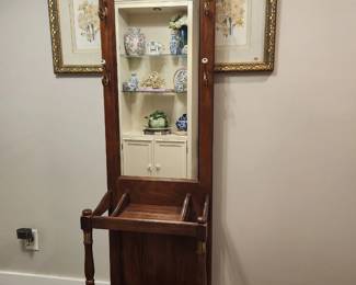Pulaski Hall tree This vintage oak wood hall tree features a tall arched mirror, four brass hooks