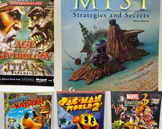 (5) Video Game Guides-Myst, Banjo Kazooie & More * Myst: Strategies and Secrets Anne Ryman, Sybex\n* Banjo-Kazooie: Nuts & Bolts Official Game Guide Prima Games\n* Age of Mythology: The Titans Expansion Official Strategies & Secrets Sybex\n* Pac-Man World 2 Prima’s Official Strategy Guide\n * Marvel vs. Capcom 3: Fate of Two Worlds BradyGames Signature Series Guide