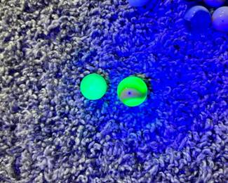 Two uranium glass marbles