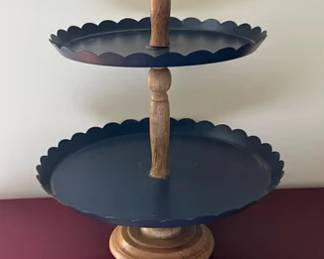 Two tiered metal and wood serving stand