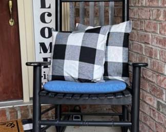 'WELCOME' sign, rocking chair and pillows