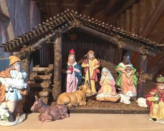 Vintage ceramic nativity set and a lighted twig manger
