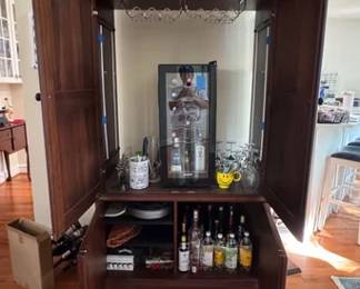 Large entertainment armoire used as a wine cabinet