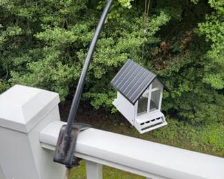 Metal bird feeders with deck railing hangers