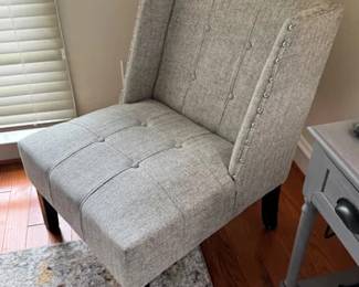 Tufted side chair with nailhead trim