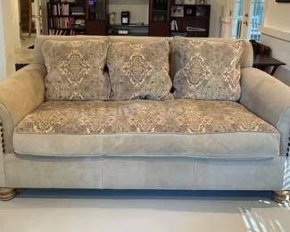 Oasis sofa manufactured by High Point Furniture, upholstered in a combination of leather and chenille aztec fabric with nailhead trim