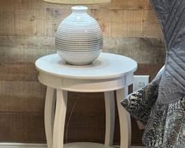 Two round side tables and pair of lamps