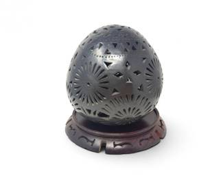 168 PiercedBlackPotteryEggSculptureonCarvedWoodStand