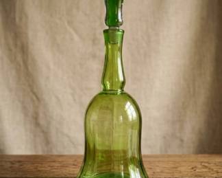 This is a highly collectible, authentic piece of American mid-century art glass produced by the renowned Blenko Glass Company. Designed in 1968 by legendary designer Joel Philip Myers (Design #6934), this striking bell-shaped floor decanter features beautiful vertical optic ribs and a vibrant brilliant green/chartreuse hue. It comes complete with its iconic dual-tone glass stopper featuring a clear exterior and a suspended green interior core.