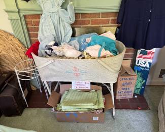 Antique bassinet, vintage baby clothes
