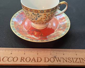 O117 - $80. "Dame A La Licorne" by Philippe Deshoulieres Tea Cup and Saucer.