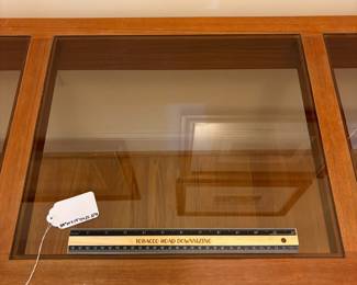 O2 - $250. MCM Danish Teak Console Table with Smokey Glass Panels. Measures 59” W x 19” D x 25.25” Tall. Bottoms of legs show wear.