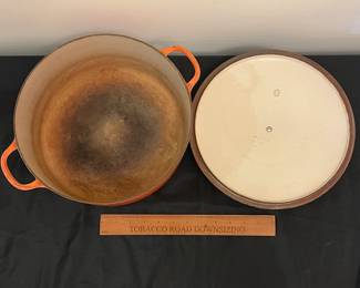 O86 - $40. Le Creuset Flame Orange “G” 7.25 Qt Dutch Oven.