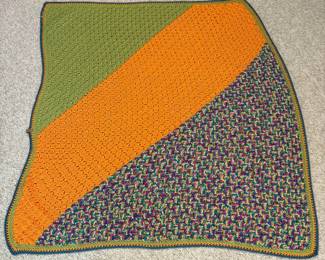 O59 - $35. Handmade Crochet Blanket. Measures 41“ W x 52” L.