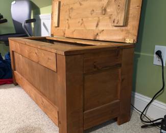 O28 - $75. Wooden Storage Chest. Measures 50” W x 19” D x 20.5” Tall.