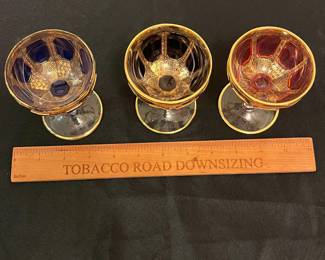 O6 - $1250. Antique Bohemian or Moser-style cut-to-clear glass decanter and cordial set with ornate gold gilding. 2 Tall Wine Glasses. 5 Champagne Coupe. Decanter & Stopper. One glass has a *tiny* chip in the base. All other pieces are in excellent condition!