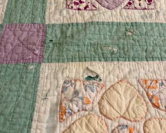 O62 - $65. Vintage Quilt. Measures 65” W x 77” L. Has some worn / thin spots.