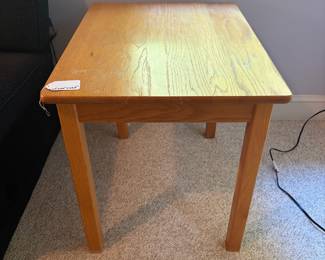 O12 - $25. Solid Wood Side Table. Measures 20” W x 26” D x 22.5” Tall.