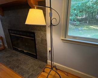 O32 - $95. Iron Floor Lamp. Shade is in good condition. Measures 58.25” Tall.
