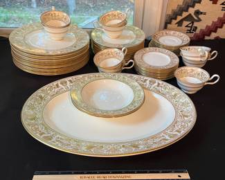 O129 - $400. Set of Wedgwood Gold "Florentine" China. 12 - 10.75" Plates, 11 - 8.25" Salad Plates, 2 - 8" Soup Bowls, 9 - 6" Bread Desert Plates, 7 - 6" Saucers, 9 - Tea Cups, 1 - 17.5" x 13.5" Oval Serving Platter.