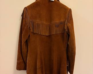 O72 - $100. 1980’s Woman’s Neiman Marcus Sued Fringe Jacket. No size. Measures 18” pit-pit, 26” shoulder-bottom hem.