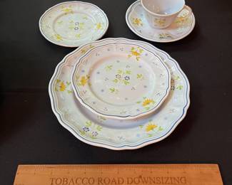 O109 - $275. Set of Longchamp "Printemps" Pottery. 9 - 10" Dinner Plates, 9 - 7.5" Salad Plates, 11 - 6.75" Desert Plates, 11 - 6.25" Saucers, 7 - Tea Cups, 1 Gravy Boat, 1 Sugar Dish.