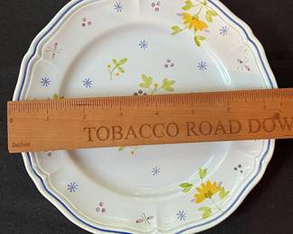 O109 - $275. Set of Longchamp "Printemps" Pottery. 9 - 10" Dinner Plates, 9 - 7.5" Salad Plates, 11 - 6.75" Desert Plates, 11 - 6.25" Saucers, 7 - Tea Cups, 1 Gravy Boat, 1 Sugar Dish.