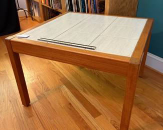 O31 - $40. Tile Top Table - one tile is cracked. Measures 27” W x 27“ D x 19” Tall.