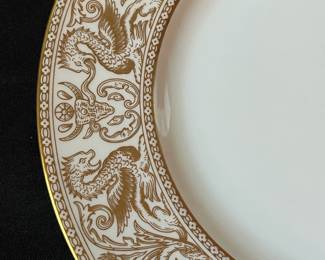 O129 - $400. Set of Wedgwood Gold "Florentine" China. 12 - 10.75" Plates, 11 - 8.25" Salad Plates, 2 - 8" Soup Bowls, 9 - 6" Bread Desert Plates, 7 - 6" Saucers, 9 - Tea Cups, 1 - 17.5" x 13.5" Oval Serving Platter.