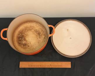 O85 - $30. Le Creuset Flame Orange “E” 4.5 Qt Dutch Oven. Lid has chips -inside is dark.