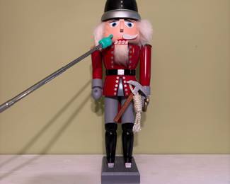 O52 - $25. Old World Christmas Fireman Nutcracker. Missing one part of mustache and long handled axe. Measures 15.5" Tall.