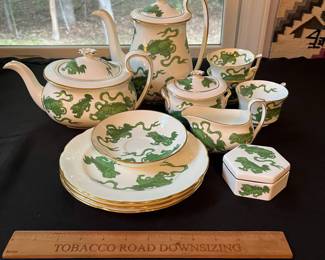 O110 - $400. Set of Wedgwood "Chinese Tigers" Green China. 1 - Coffee Pot, 1 Tea Pot (has a crack), 1 - Saucer, 1 - Trinket Dish, 1 - Cream and Sugar, 3 - Tea Cups, 3 - 8.25" Plates