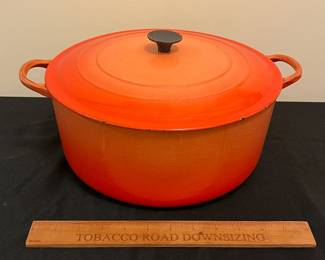 O86 - $40. Le Creuset Flame Orange “G” 7.25 Qt Dutch Oven.