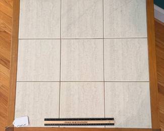 O31 - $40. Tile Top Table - one tile is cracked. Measures 27” W x 27“ D x 19” Tall.