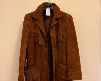 O72 - $100. 1980’s Woman’s Neiman Marcus Sued Fringe Jacket. No size. Measures 18” pit-pit, 26” shoulder-bottom hem.