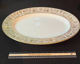 O129 - $400. Set of Wedgwood Gold "Florentine" China. 12 - 10.75" Plates, 11 - 8.25" Salad Plates, 2 - 8" Soup Bowls, 9 - 6" Bread Desert Plates, 7 - 6" Saucers, 9 - Tea Cups, 1 - 17.5" x 13.5" Oval Serving Platter.
