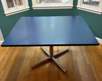 O4 - $125. Table Measures 40” W x 50” L x 28.75” Tall. Blue Laminate top with Chrome Base.