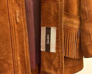 O72 - $100. 1980’s Woman’s Neiman Marcus Sued Fringe Jacket. No size. Measures 18” pit-pit, 26” shoulder-bottom hem.
