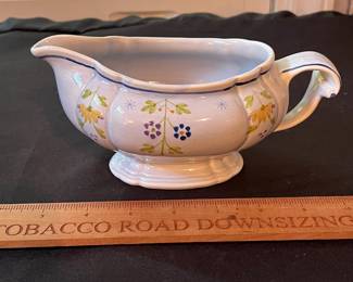 O109 - $275. Set of Longchamp "Printemps" Pottery. 9 - 10" Dinner Plates, 9 - 7.5" Salad Plates, 11 - 6.75" Desert Plates, 11 - 6.25" Saucers, 7 - Tea Cups, 1 Gravy Boat, 1 Sugar Dish.