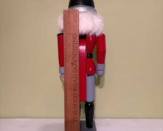 O52 - $25. Old World Christmas Fireman Nutcracker. Missing one part of mustache and long handled axe. Measures 15.5" Tall.