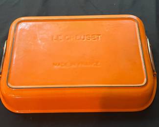 O118 - $45. Le Creuset Flame Orange 15” x 10” Iron Roasting Pan.