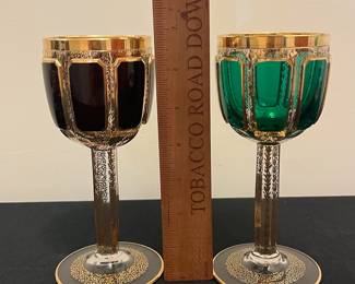 O6 - $1250. Antique Bohemian or Moser-style cut-to-clear glass decanter and cordial set with ornate gold gilding. 2 Tall Wine Glasses. 5 Champagne Coupe. Decanter & Stopper. One glass has a *tiny* chip in the base. All other pieces are in excellent condition!