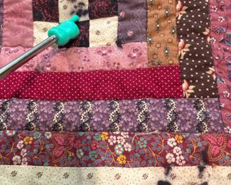 O61 - $75. Vintage Handmade Quilt. Measures 58” W x 58” L.