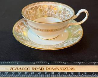 O129 - $400. Set of Wedgwood Gold "Florentine" China. 12 - 10.75" Plates, 11 - 8.25" Salad Plates, 2 - 8" Soup Bowls, 9 - 6" Bread Desert Plates, 7 - 6" Saucers, 9 - Tea Cups, 1 - 17.5" x 13.5" Oval Serving Platter.