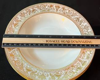 O129 - $400. Set of Wedgwood Gold "Florentine" China. 12 - 10.75" Plates, 11 - 8.25" Salad Plates, 2 - 8" Soup Bowls, 9 - 6" Bread Desert Plates, 7 - 6" Saucers, 9 - Tea Cups, 1 - 17.5" x 13.5" Oval Serving Platter.