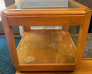O33 - $20. Glass Top Side Table. Has water marks on the bottom layer. Structurally sound. Measures 24” W x 28” D x 21” Tall.