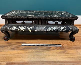 O124 - $850. Antique Kang Table. (Possibly Late Ming-early Qing Dynasty. 17th - 18th Century) Mother of Pearl Inlaid Black Lacquer Low Table. Measures 25" W x 14.5" D x 8.5" Tall.
