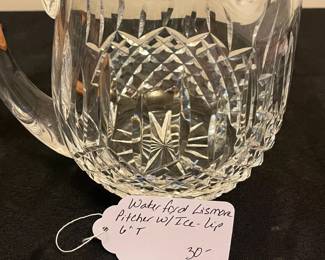 O95 - $30. Waterford Crystal “Lismore” Pitcher with Ice Lip. Measures 6” Tall.