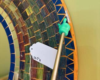 O30 - $5. Tile Mirror. Damaged. Measures 23.5” Diameter.