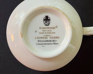 O110 - $400. Set of Wedgwood "Chinese Tigers" Green China. 1 - Coffee Pot, 1 Tea Pot (has a crack), 1 - Saucer, 1 - Trinket Dish, 1 - Cream and Sugar, 3 - Tea Cups, 3 - 8.25" Plates